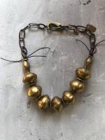African Brass Saucer Beads by Debe Dohrer